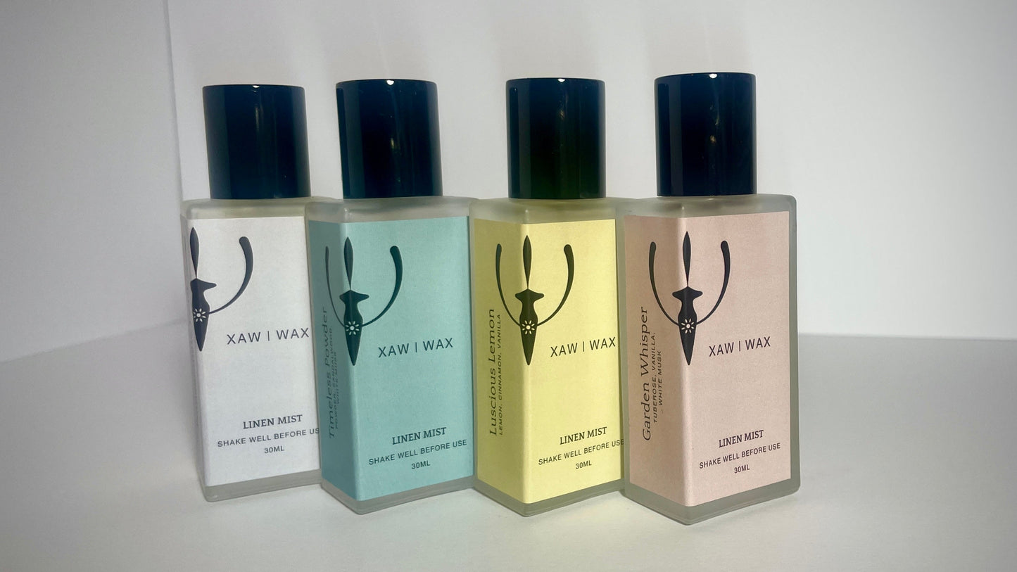 The XAW Linen Mist collection in amber glass bottles