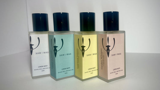 The XAW Linen Mist collection in amber glass bottles