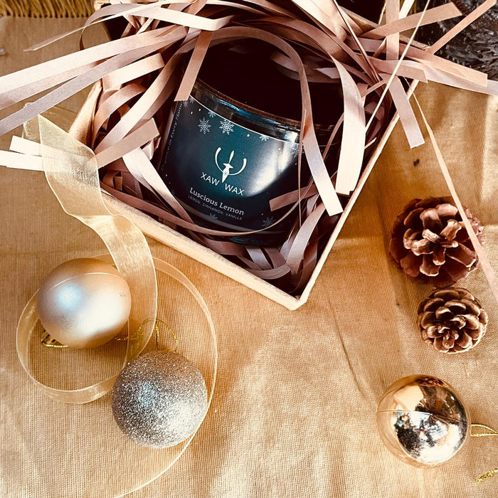XAW candle in a gift box with ribbon