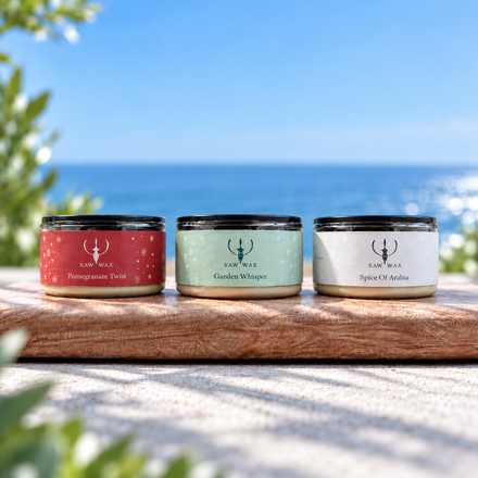 The Trio: Pomegranate Twist, Garden Whisper and Spice of Arabia candles by the sea